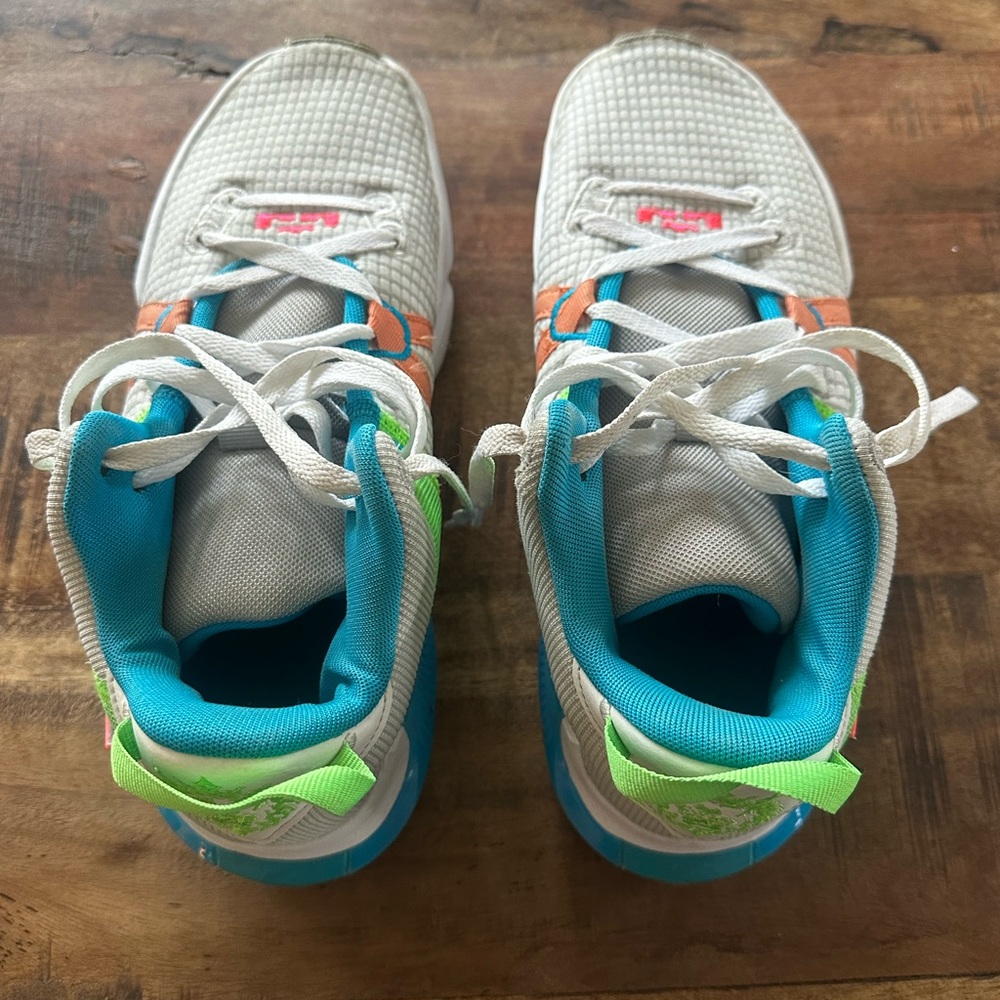 Nike White and Blue Athletic Shoes with Orange Accents